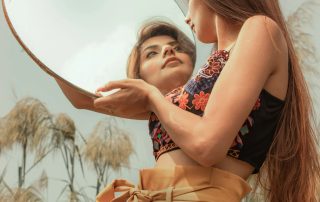 girl looking at the mirror
